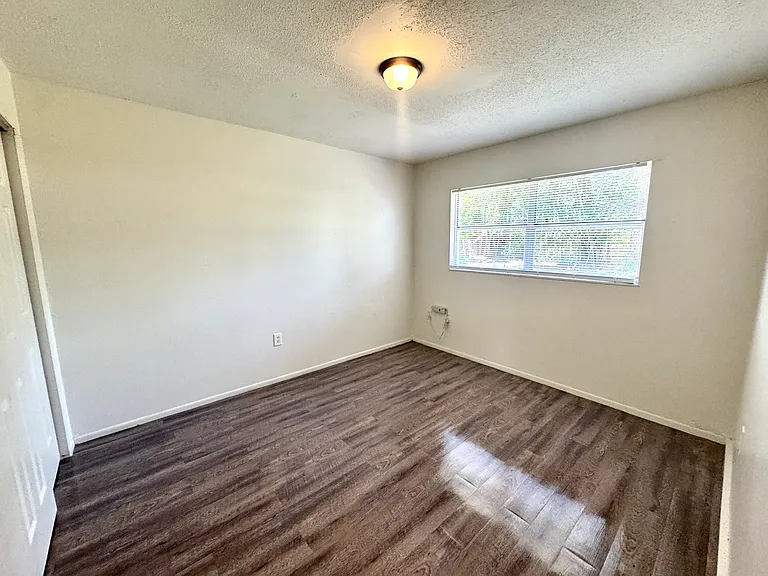 Interior photos are of a neighboring unit with identical floor plan. Paint color is the same, but the flooring is actually ceramic tile.