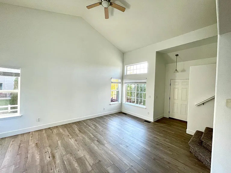 Large living room with remote-controlled ceiling fan and light