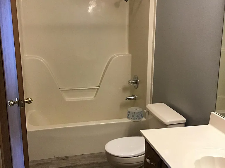 Bathroom with entry to 2nd bedroom and hallway