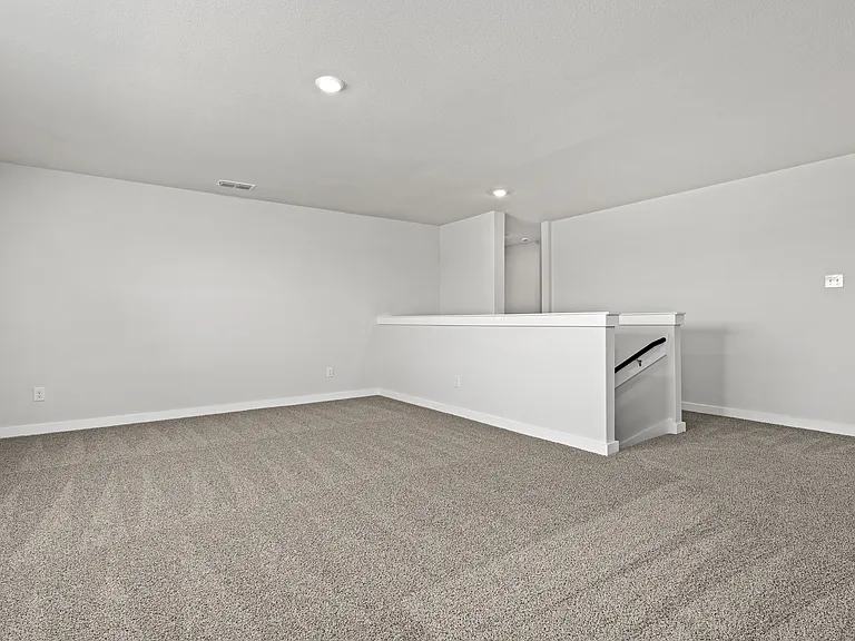 Upstairs, the gameroom loft is an extended, versatile living space.