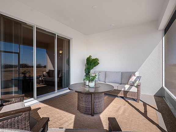 Your interior opens to outdoor living space on a large covered lanai - Monroe by Highland Homes