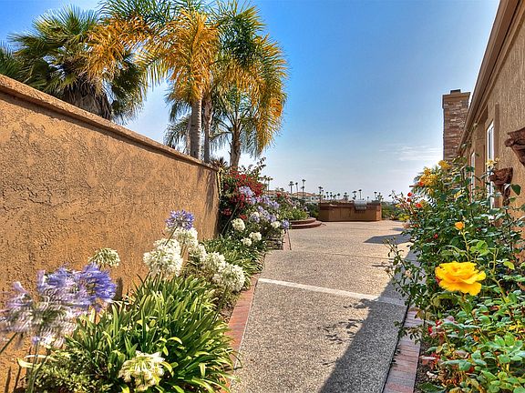 Large gated private yard with a beautiful rose garden.  