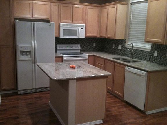 Kitchen has granite countertops