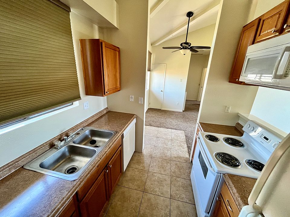 Kitchen features dishwasher, microwave and refrigerator. Washer and dryer also in unit.