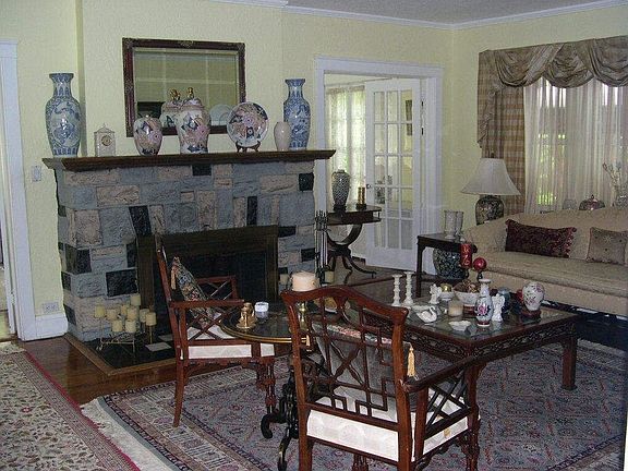 Living room with stone fireplace