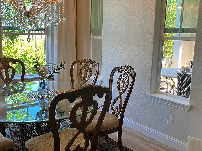 Dining room. The chandelier will be removed. It has a view of the California Room.