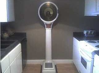 Galley style kitchen with tiffany style lighting