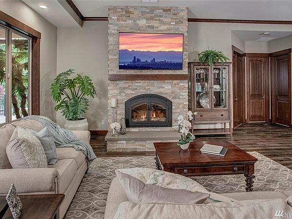 Easy flow between the great room and the massive covered deck which also features a floor to ceiling fireplace wired for TV.