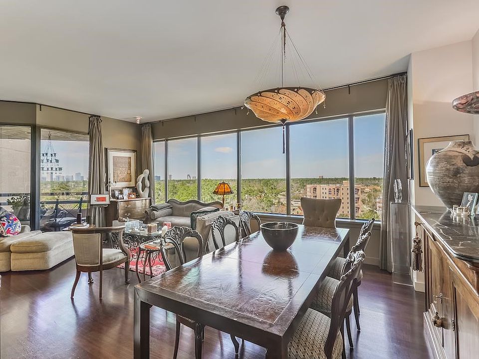 Light filled Living and Dining Area boasts sprawling views of the city.