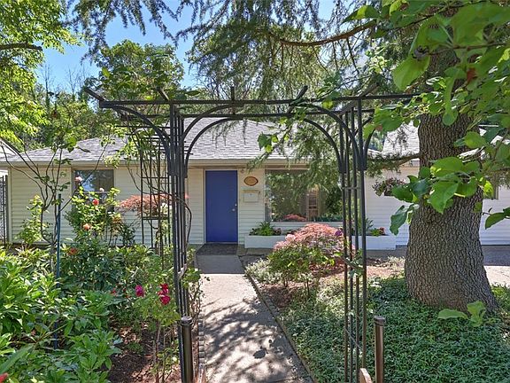 Come up the staircase and under the trellis to your new home! Freshly painted inside and out with new roof!