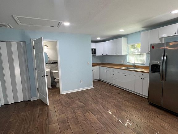 View from the living area to the bathroom and kitchen.