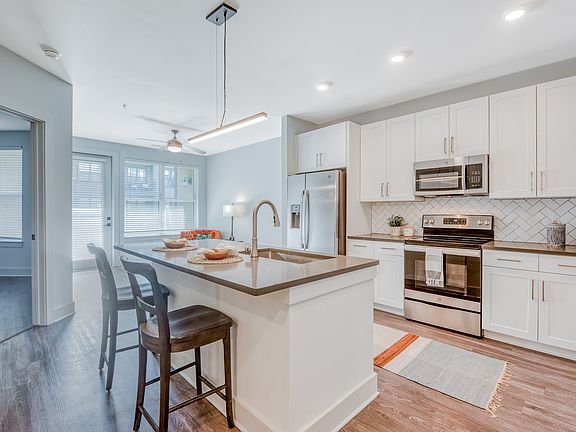 Our gourmet kitchens feature designer finishes and stainless steel appliances.