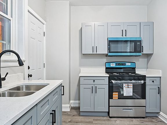 Photo is from a similar unit in the building...