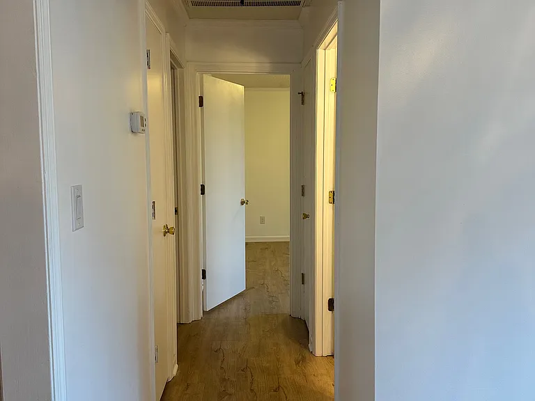 Hallway from dining area to secondary bedrooms and Bath