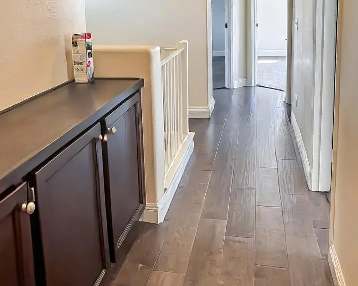 Upstairs hallway connecting all the rooms and cabinets
