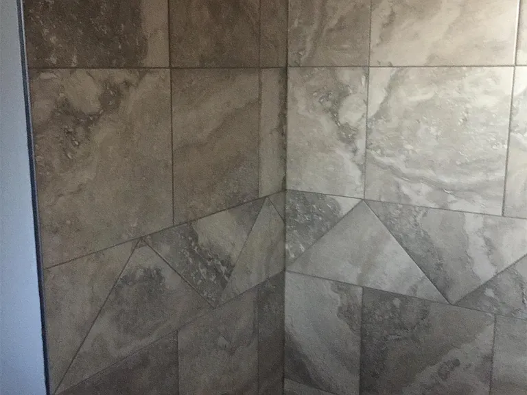 Bathroom bathtub with Moen shower head and accessories