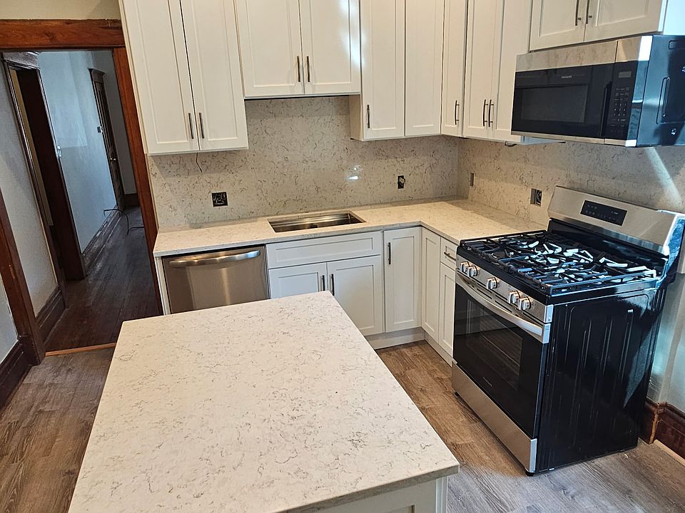 All new flooring, cabinets, appliances and countertops.