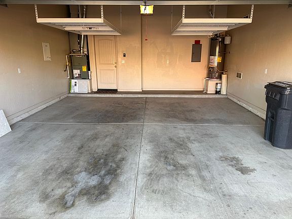 2 car garage with overhead storage. SUV fits under storage
