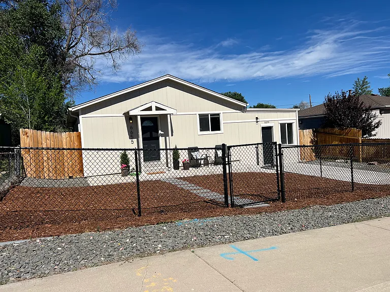 A rare Denver find: A fully fenced, front yard for your four-legged family members, plus a designated off-street parking space for your car!