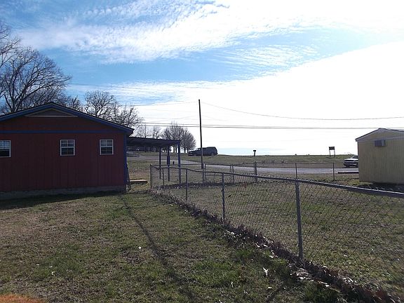 VIEW FROM BACK FENCE TO ROAD