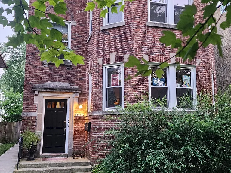 Outside of duplex building. Owners live on first floor and rent out the second floor.