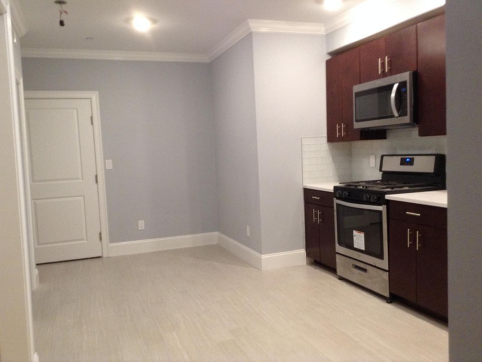 Spacious Kitchen to fit a nice table to serve everyone! Cherry wood cabinets with built in microwave.