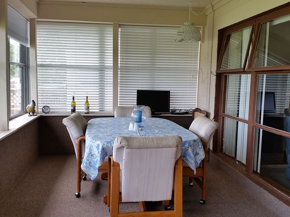 Glassed-in porch faces lake