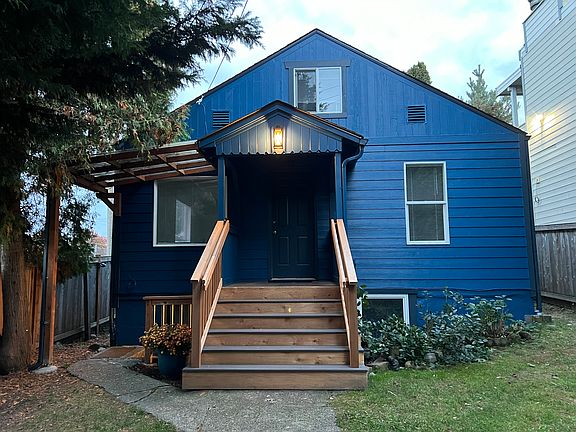 Fresh paint brings out the charm of this sweet duplex. Large, sunny, secure front yard with garden space.