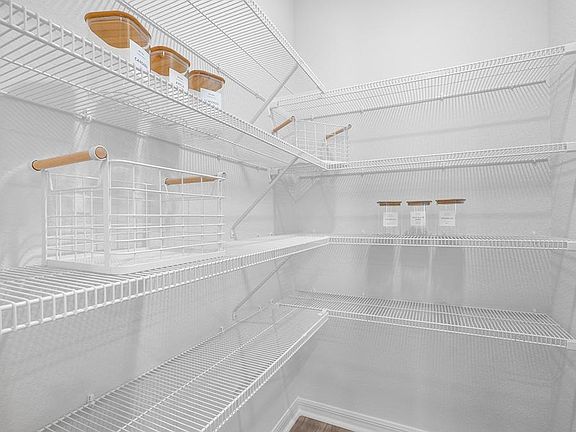 A walk-in pantry provides storage convenience - Raychel by Highland Homes