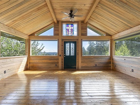 The STUNNING sunroom is an amazing place to be 365 days a years! The walls and ceilings are wrapped with blue pine and soak up t