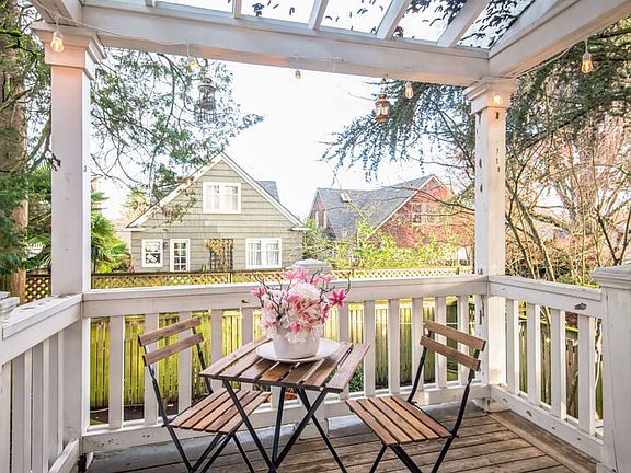 Porch off main bedroom leading into the fenced backyard
