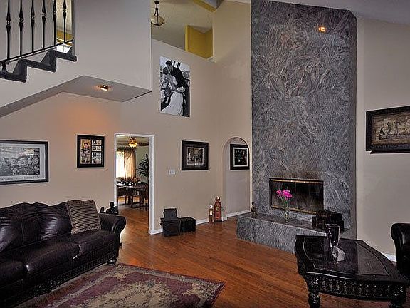2nd view of Living Room with granite fireplace
