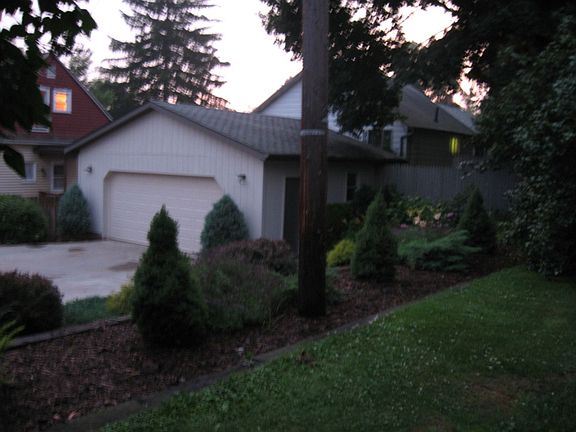 Garage with landscaping