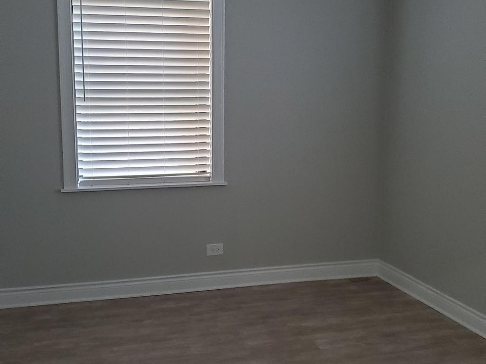Bedroom with ceiling fan.