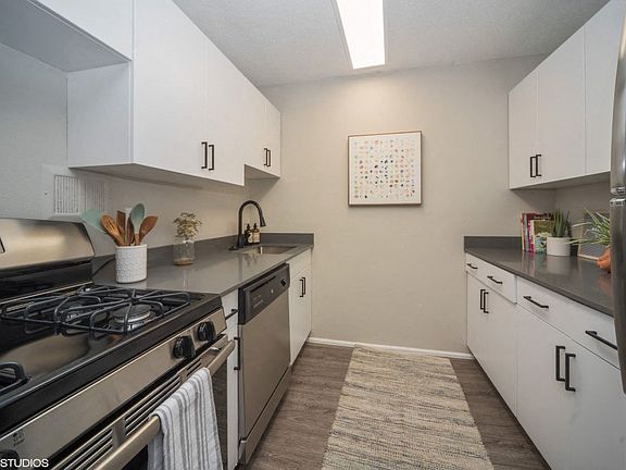 Sleek kitchen with a gas top stove