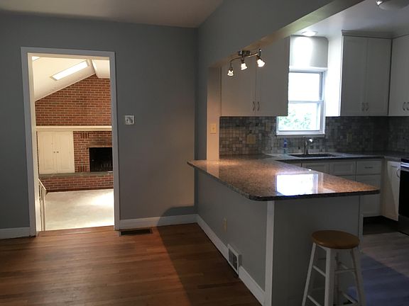 Remodeled kitchen with breakfast bar and open to dining room