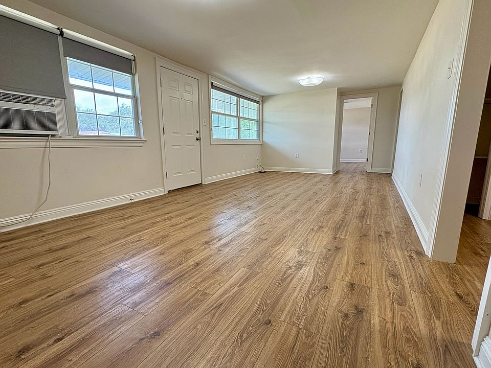 Open greatroom for living and dining - nice natural light and custom fabric roller shades throughout!