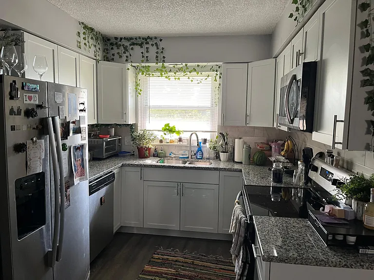 Updated Kitchen with granite countertops with stainless steel appliances.