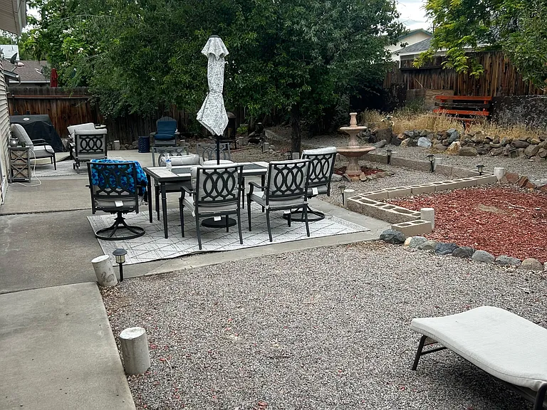 Back yard. Table chairs, umbrella will be staying in back yard
