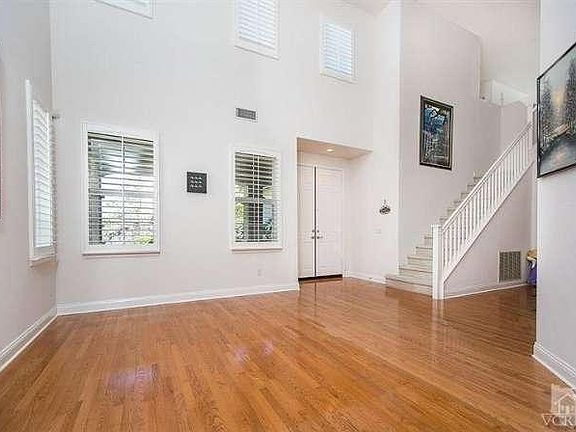 Enter into a wonderful home! with lovey wood floors, Volume ceilings and loads of windows!