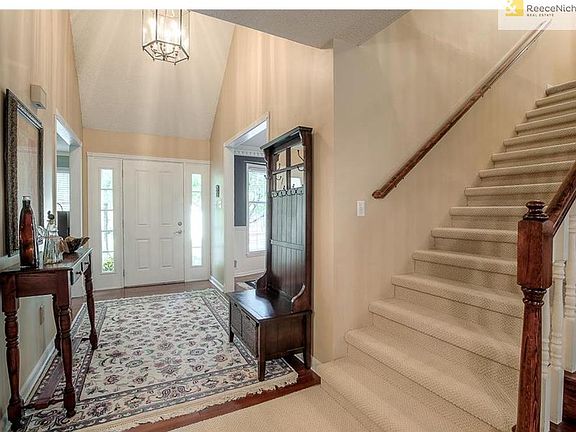 VAULTED ENTRY WITH WOOD FLOOR