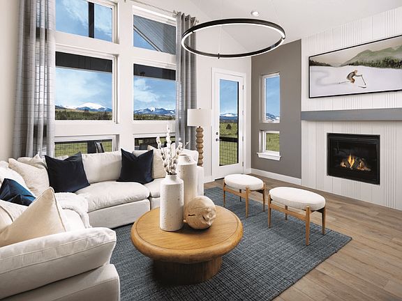 The living room features vaulted ceilings that create an open, airy feel and is conveniently located