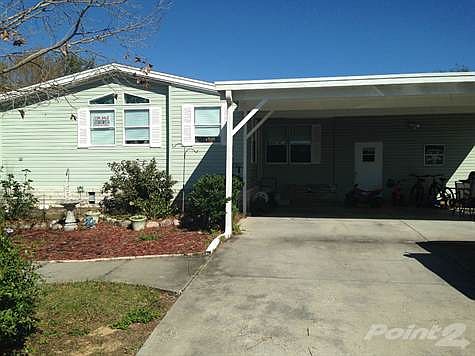 Front View With Carport