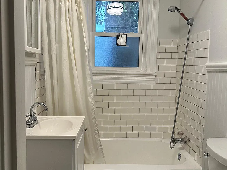 New tile, refinished tub and new hardwood floors