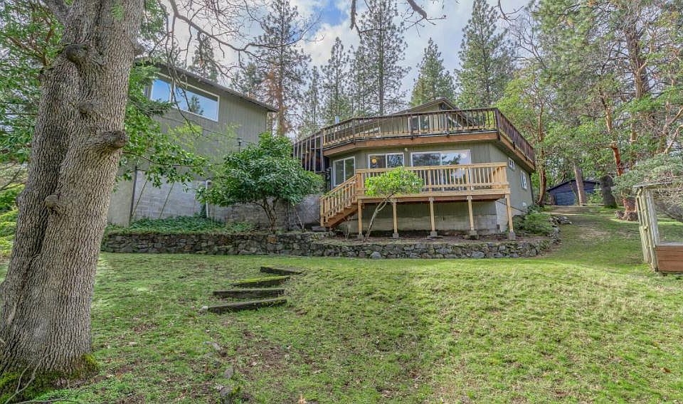 Upper and lower decks and fenced back yard. Yard has raised beds for gardening.