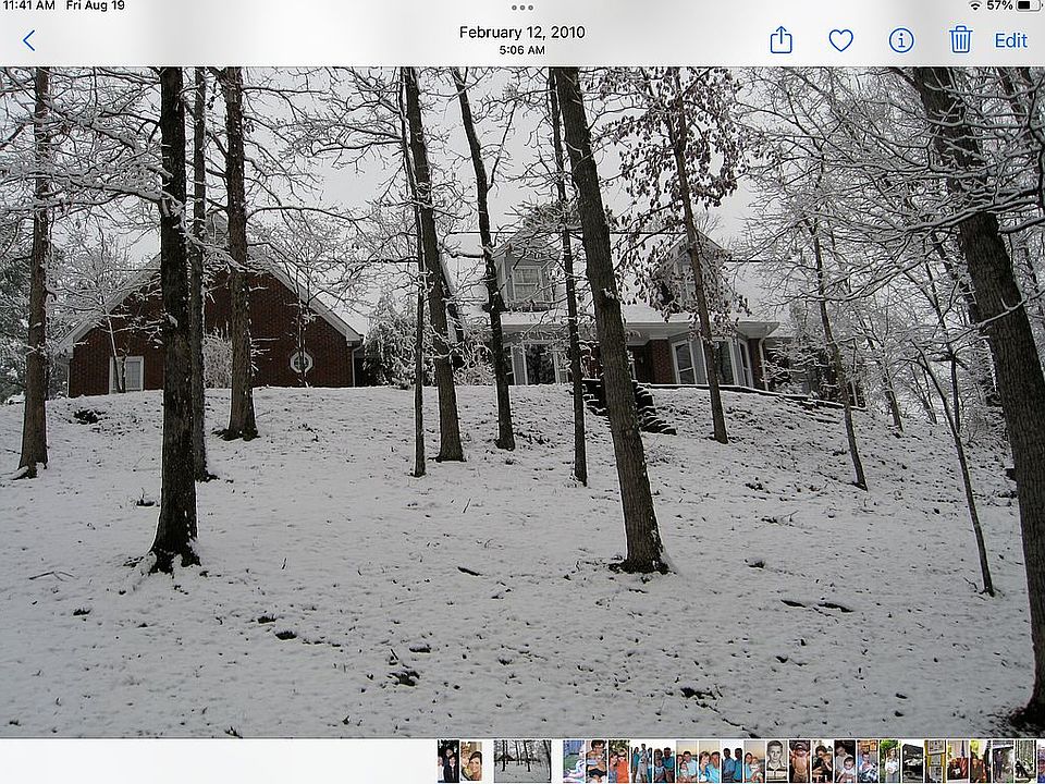 Winter snow front of house