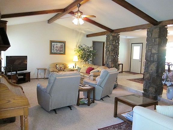 Sunken living with beamed, vaulted ceiling