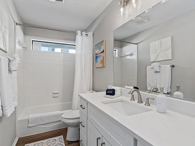 Hall Bathroom with Large Vanity with Lots of counterspace & 6 drawers. Tub Shower Combo with 2 layer Shower Curtain. All Linens Included