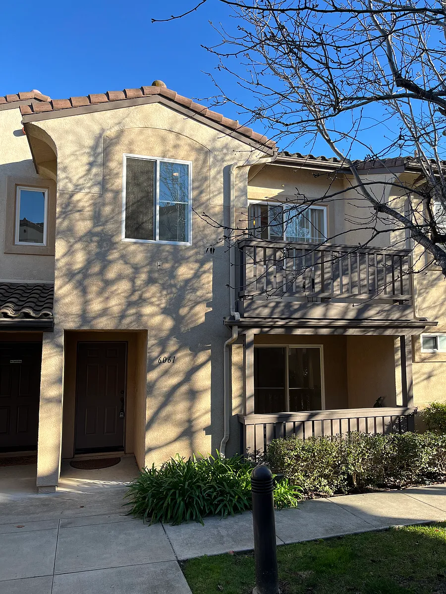 Front exterior of townhouse featuring both balconies and lots of windows for natural light - 6061 Paseo Salinero