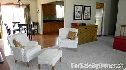 Open Concept Living/Dining/Kitchen
						:
						Neutral paint and carpet in open concept living area